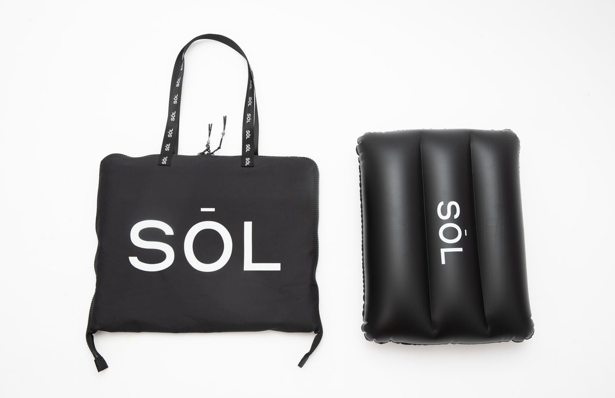 SŌL Deluxe tote and inflatable pillow photographed in the studio